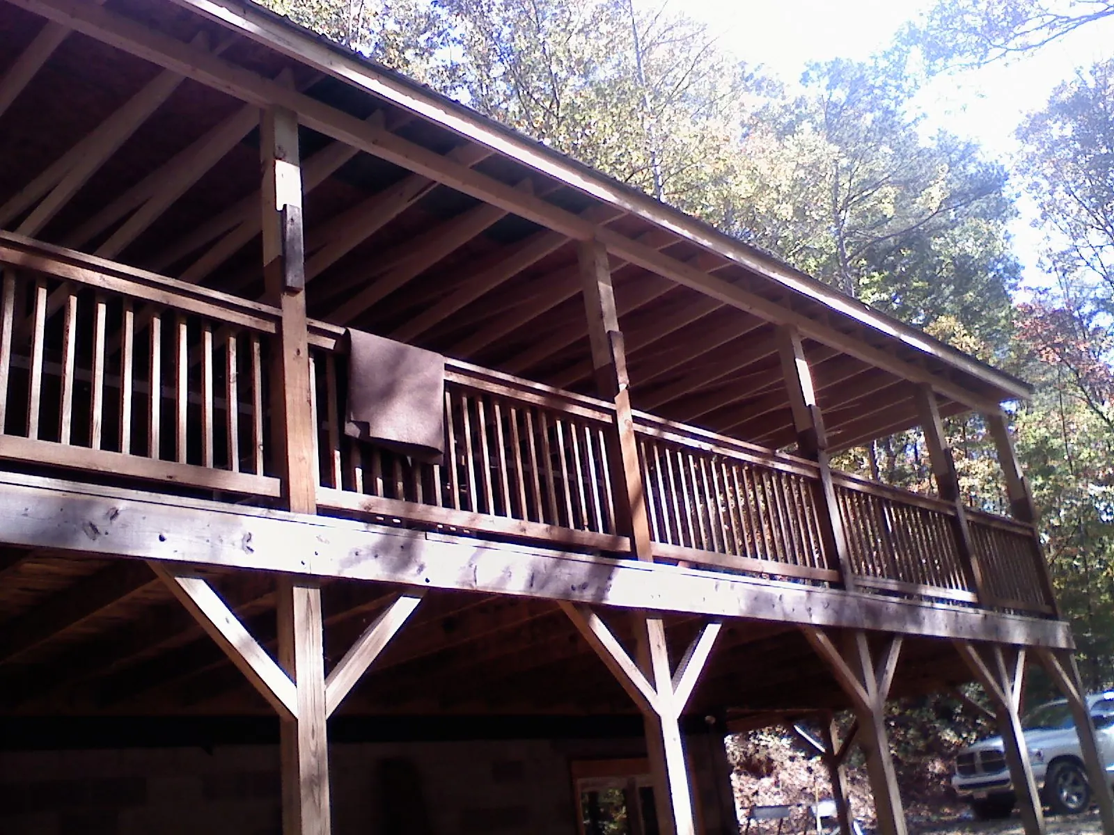 Timber framing under a new elevated porch and deck — Roof Leak Repair in Wilmer by Roofing Brothers